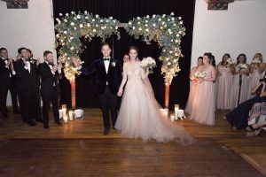 Lauren & Brett Wedding - Liberty Warehouse Brooklyn - Ceremony Arch Silver Dollar Eucalyptus White Tibet Roses