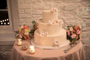 Kat & Ryan Wedding - Cake Table Astilbe Dahlia Dusty Miller Silver Dollar Euc Lisianthus Ranunculus Spray Rose - Stone Mill at New York Botanical Garden - by Laurie Rhodes - 194843