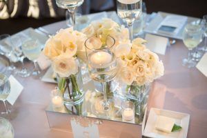 Sophia & Sam Wedding - Low Centerpiece Calla Lily Phalaenopsis Orchid Ranunculus Garden Majolica Rose - Tribeca 360 NYC - by Shira Weinberger