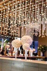 Stefanie & Jon Wedding - Entrance Table Arrangements Carnation Pomander Ball on Pilsner Vase - riverpark NYC - Photography by Trent Bailey